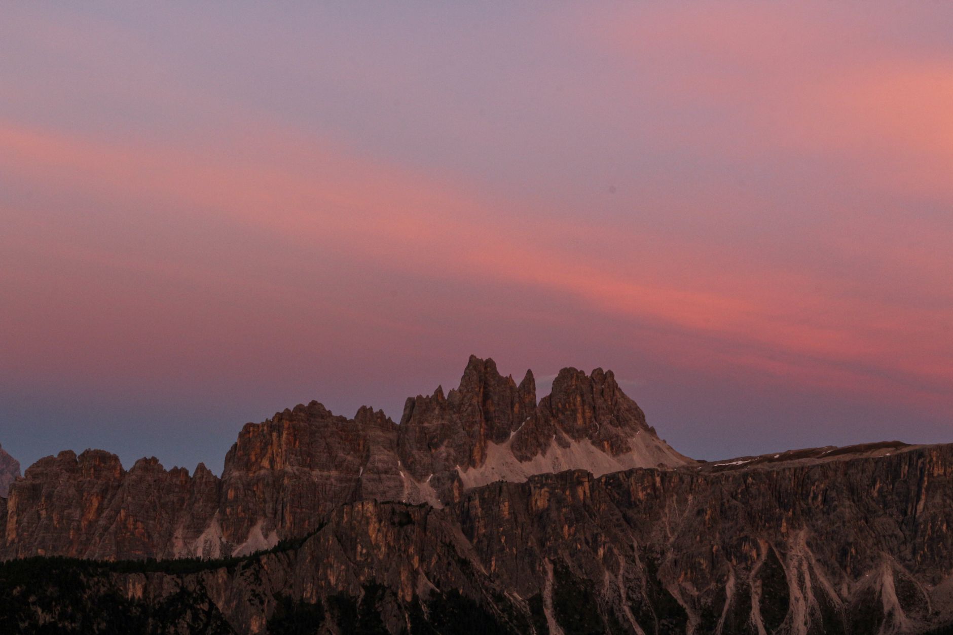 Sunrise over rugged dolomite peak
