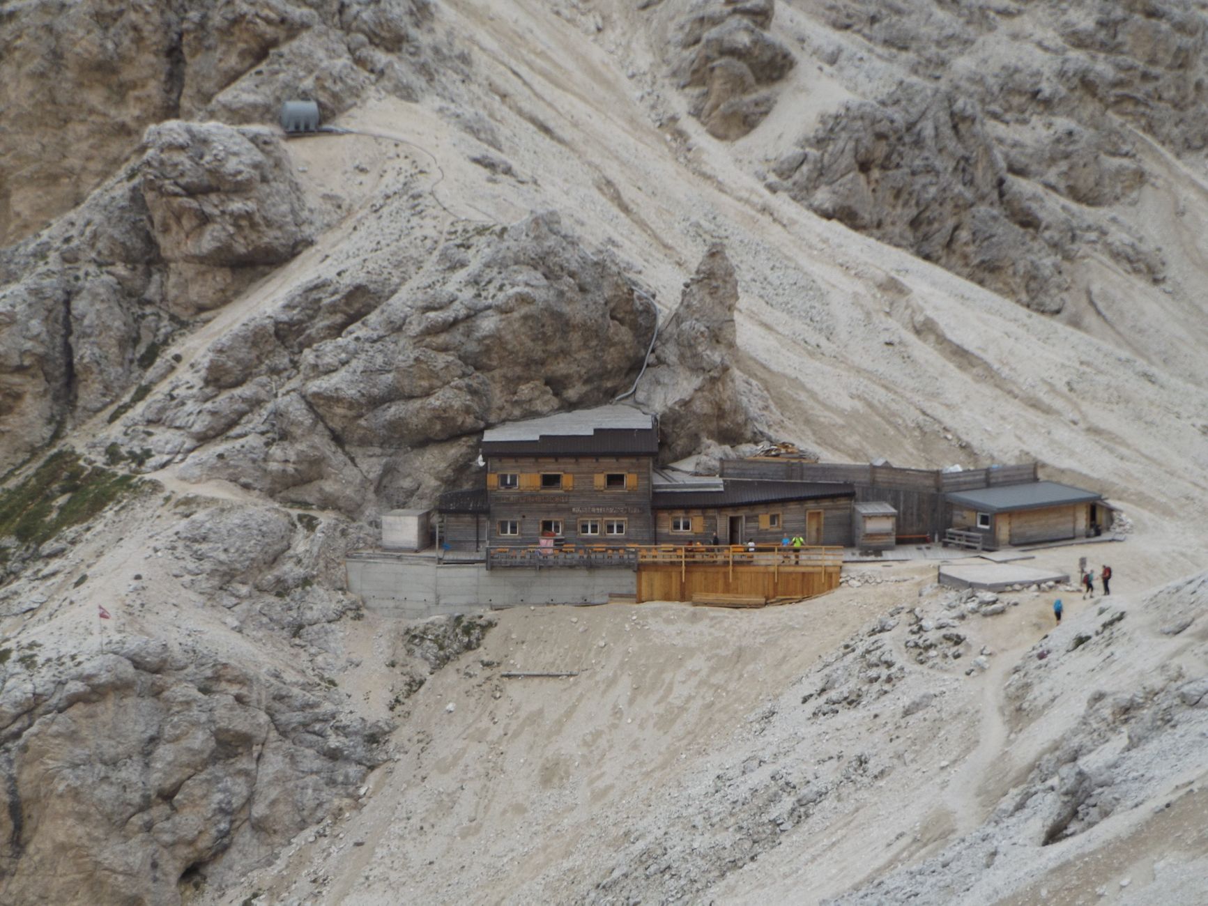 Mountain shelter nestled in alpine meadow