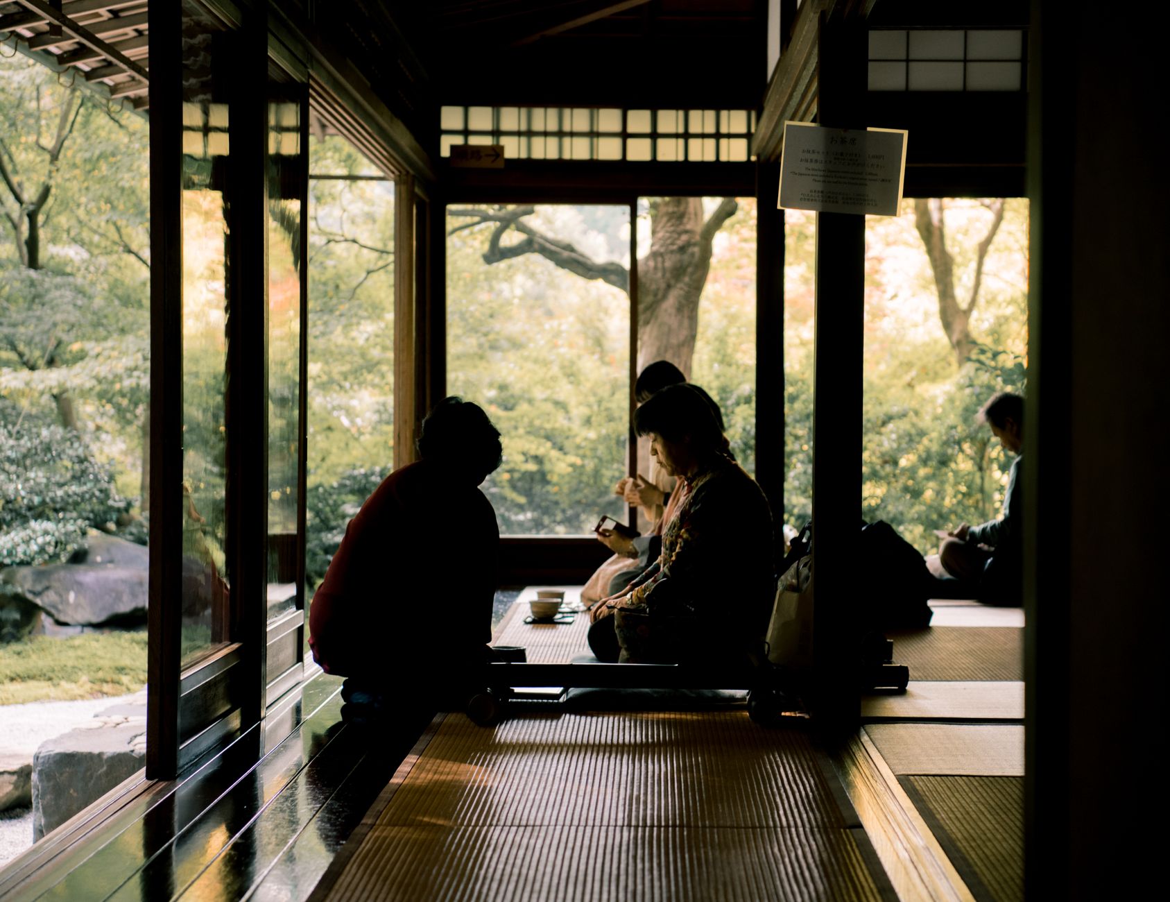 Wooden veranda overlooking raked gravel garden